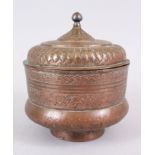 AN 18TH CENTURY TURKISH OTTOMAN COPPER BOWL AND LID, signed and dated 1779, 22cm high, 18cm wide.