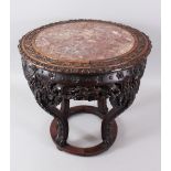 A GOOD 19TH CENTURY CHINESE CARVED HARDWOOD MARBLE TOP STAND, with carved floral decoration, the