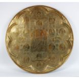 AN EXTREMELY FINE 19TH CENTURY PERSIAN QAJAR HAND CHASED CIRCULAR TRAY, with Arabic scene showing