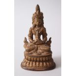 A 19TH CENTURY SINO TIBETAN BRONZE BUDDHA / DEITY, modeled upon a lotus form base, 13.5cm high x 8cm