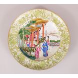 A GOOD 19TH CENTURY CHINESE CANTON PLATE, decorated with scenes of figures amongst temple and