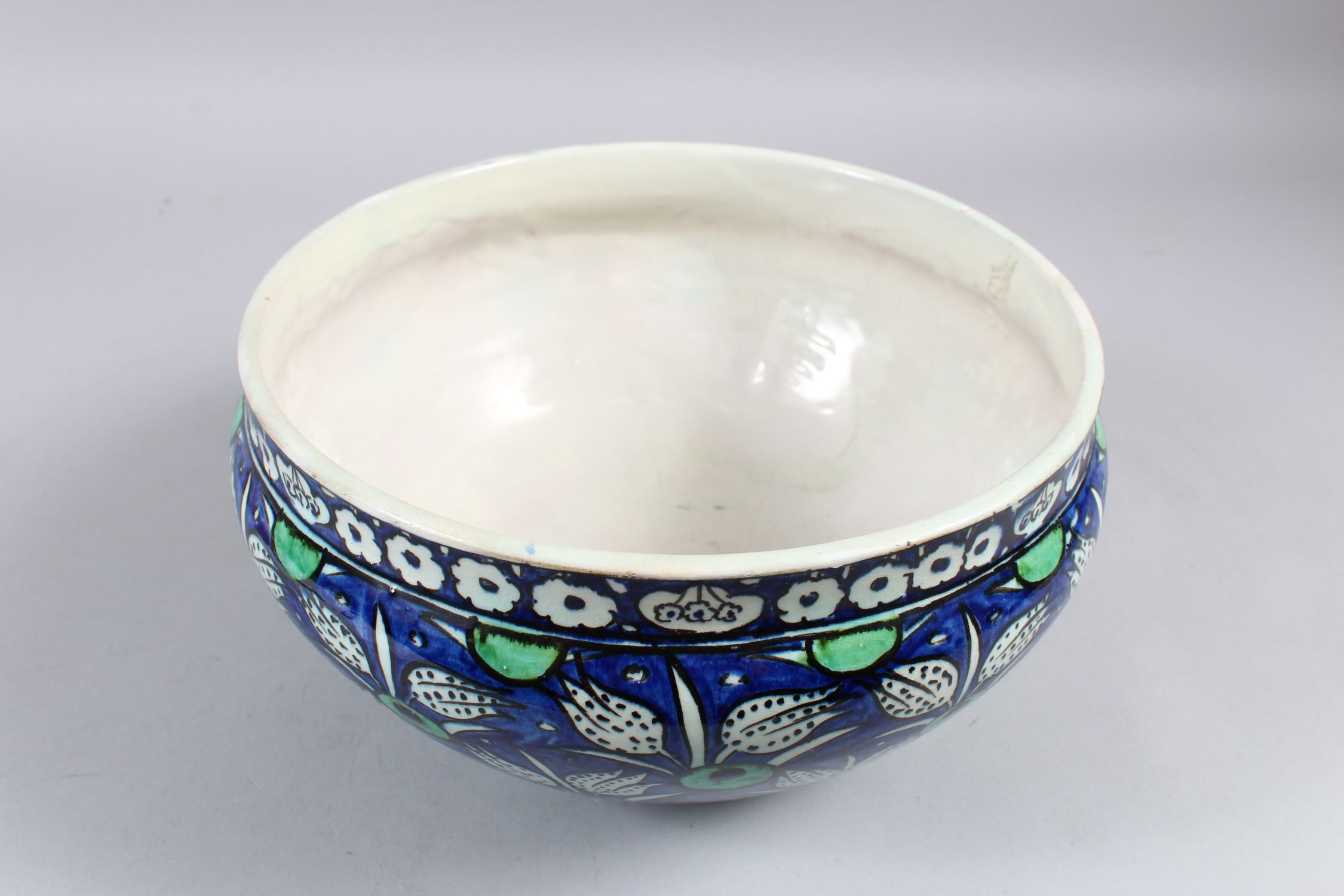 A 19TH CENTURY IZNIK STYLE POTTERY CIRCULAR BOWL, the sides with blue ground and flower heads, - Image 4 of 5