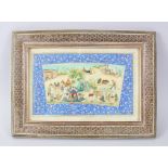 A PERSIAN PAINTING ON IVORY, tents, figures on camels and cows, 10cm x 20cm in a mosaic frame.