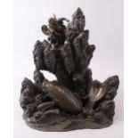 A GOOD JAPANESE MEIJI PERIOD BRONZE SCULPTURE / OKIMONO OF KOI CARP, the bronze forming a rocky