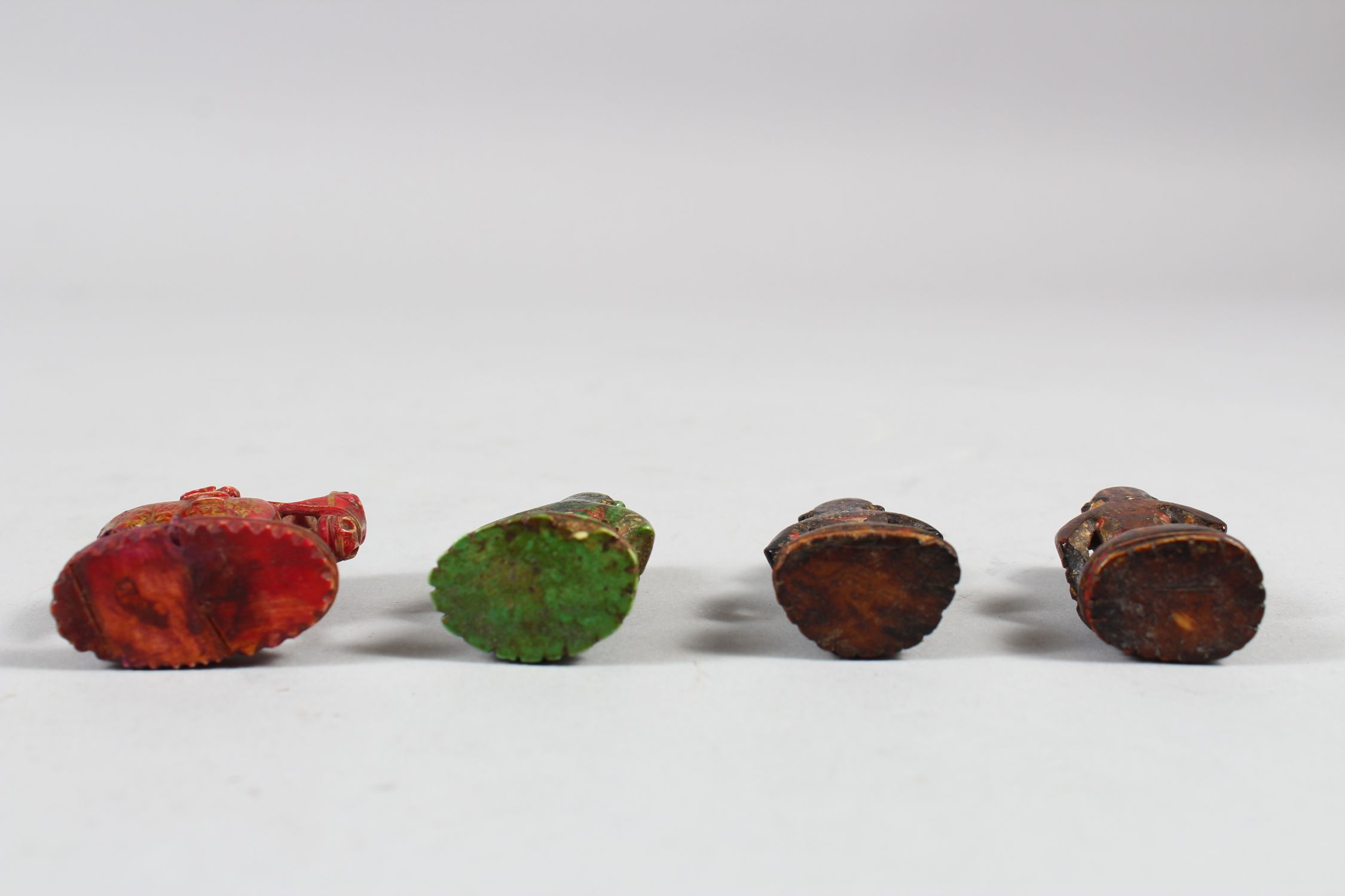 A COLLECTION OF FOUR 17TH CENTURY INDIAN POYCHROME IVORY CHESS PIECES, 5cm high. - Image 3 of 4