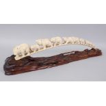 A LARGE JAPANESE MEIJI PERIOD CARVED IVORY BEAR BRIDGE GROUP OKIMONO, the bridge croup consisting of