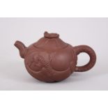 A 20TH CENTURY CHINESE YIXING TEAPOT AND COVER, the lid with a moving dragons head, the body with