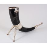 A HALLMARKED SILVER DRINKING HORN on silver legs, 30cm long.