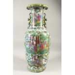 A LARGE 19TH CENTURY CHINESE FAMILLE ROSE VASE, decorated with various panels depicting figures