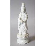 A LATER 19TH CENTURY CHINESE BLANC DE CHINE FIGURE OF GUANYIN, stood upon a lotus moulded base