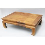 A SMALL CHINESE HARDWOOD KANG TABLE, 21cm high x 63cm wide x 46.5cm deep.