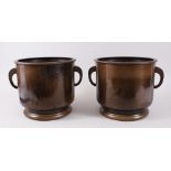 A PAIR OF EARLY 20TH CENTURY CHINESE BRONZE & SILVER INLAID TWIN HANDLE JARDINIERE'S, the pots