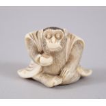 A JAPANESE MEIJI PERIOD IVORY NETSUKE OF A MONKEY, seated wearing a robe, holding a gourd, 3cm