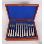 A SUPERB SET OF TWELVE INDIAN SILVER FISH KNIVES AND FORKS 'CUTCH' with engraved blades, the handles