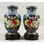A PAIR OF REPUBLICAN CHINESE CLOISONNE VASES & WOOD STANDS, the vases with a blue ground and