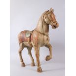 A 17TH / 18TH CENTURY CHINESE WOODEN TANG STYLE HORSE, with one hoof aloft, with painted