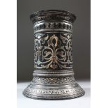 AN 18TH-19TH CENTURY INDIAN BIDRI SILVER INLAID CIRCULAR TORCH STAND, 23cm high.