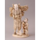 A FINE JAPANESE MEIJI PERIOD CARVED IVORY OKIMONO GROUP, comprising a woodsman carrying a large roll