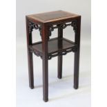 A GOOD 19TH CENTURY CHINESE HARDWOOD TWO TIER STAND, the top of rectangular form with a lower