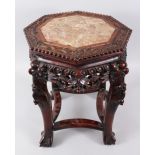 A GOOD 19TH CENTURY CHINESE CARVED HARDWOOD & MARBLE TOP OCTAGONAL TABLE, the top inset with marble,