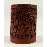 A 19TH / 20TH CENTURY CHINESE BAMBOO BRUSH POT, carved with deep relief to depict scenes of