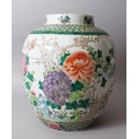 A GOOD LARGE 19TH CENTURY CHINESE FAMILLE VERTE PORCELAIN POT / VASE, decorated with displays of