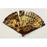 A JAPANESE MEIJI PERIOD WOOD & GOLD LACQUER FAN, decorated with scenes of figures beside temple
