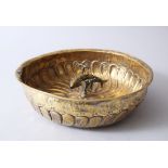 AN 18TH CENTURY OTTOMAN TURKISH BRASS HAMMAM BOWL with reticulated fish at its centre.