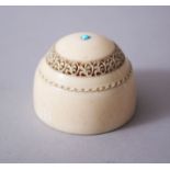 A CARVED POSSIBLY INDIAN IVORY LIDDED BOX.