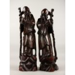 A GOOD PAIR OF 19TH / 20TH CENTURY CHINESE CARVED HARDWOOD FIGURES OF SHOU LOU, both the carvings