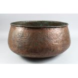 A LARGE 15TH CENTURY MAMLUK COPPER BOWL EYGPT OR SYRIA with engraved band, 38cm diameter.