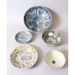A COLLECTION OF FIVE 16TH-17TH CENTURY PERSIAN POTTERY PIECES, three bowls and two plates.