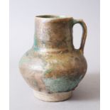 A 12TH-13TH CENTURY PERSIAN OR SYRIAN GOLD SPLASH POTTERY JUG, 19cm high.