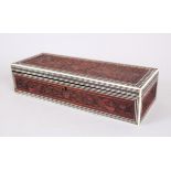 A 19TH CENTURY INDIAN IVORY INLAID CARVED SANDLEWOOD BOX, 31cm long.
