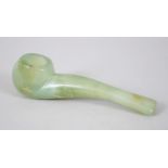 A CHINESE CARVED JADE PIPE, 11cm long X 2.5cm wide.