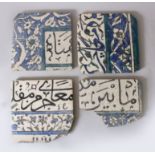 A COLLECTION OF FOUR 16TH-17TH CENTURY DAMASCUS CALLIGRAPHY TILES, 23cm x 21cm.