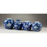 FOUR CHINESE BLUE & WHITE PORCELAIN PRUNUS GINGER JARS, one with a cover, all bearing double blue