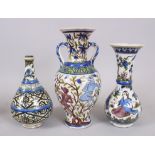 A COLLECTION OF THREE PERSIAN QAJAR POTTERY VASES, 33cm, 28cm, 24cm high.
