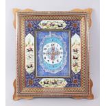 A PERSIAN FRAMED MOSAIC CLOCK with four vignettes; playing polo, 45cm x 38cm.