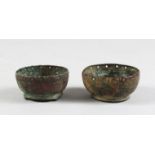 TWO 10TH CENTURY SMALL ISLAMIC GHAZNAVID BRONZE BOWLS, 7cm diameter.