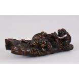 A GOOD QUALITY JAPANESE MEIJI PERIOD WOODEN MONKEY GROUP OKIMONO, finely carved to depict four