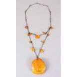 A GOOD LARGE AMBER PENDANT NECKLACE, 58 grams.