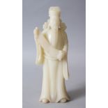 A CHINESE CARVED JADE FIGURE OF A SCHOLAR / SAGE, stood holding his scroll, 27cm high x 10cm.
