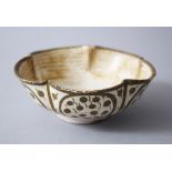 A 9TH-10TH CENTURY MESOPOTAMIAN ABBASID GLAZED POTTERY BOWL bearing an image of a bird in the