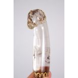 A MOGHUL INDIAN GOLD INLAID ROCK CRYSTAL RAMS HEAD DAGGER HANDLE, 11cm long.