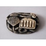 A JAPANESE MEIJI PERIOD CARVED & STAINED IVORY NETSUKE OF ROPE AND UTENSILS, 4cm wide x 3cm deep.