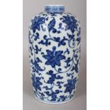 A CHINESE MING STYLE BLUE & WHITE PORCELAIN VASE, decorated with formal scrolling foliage, the