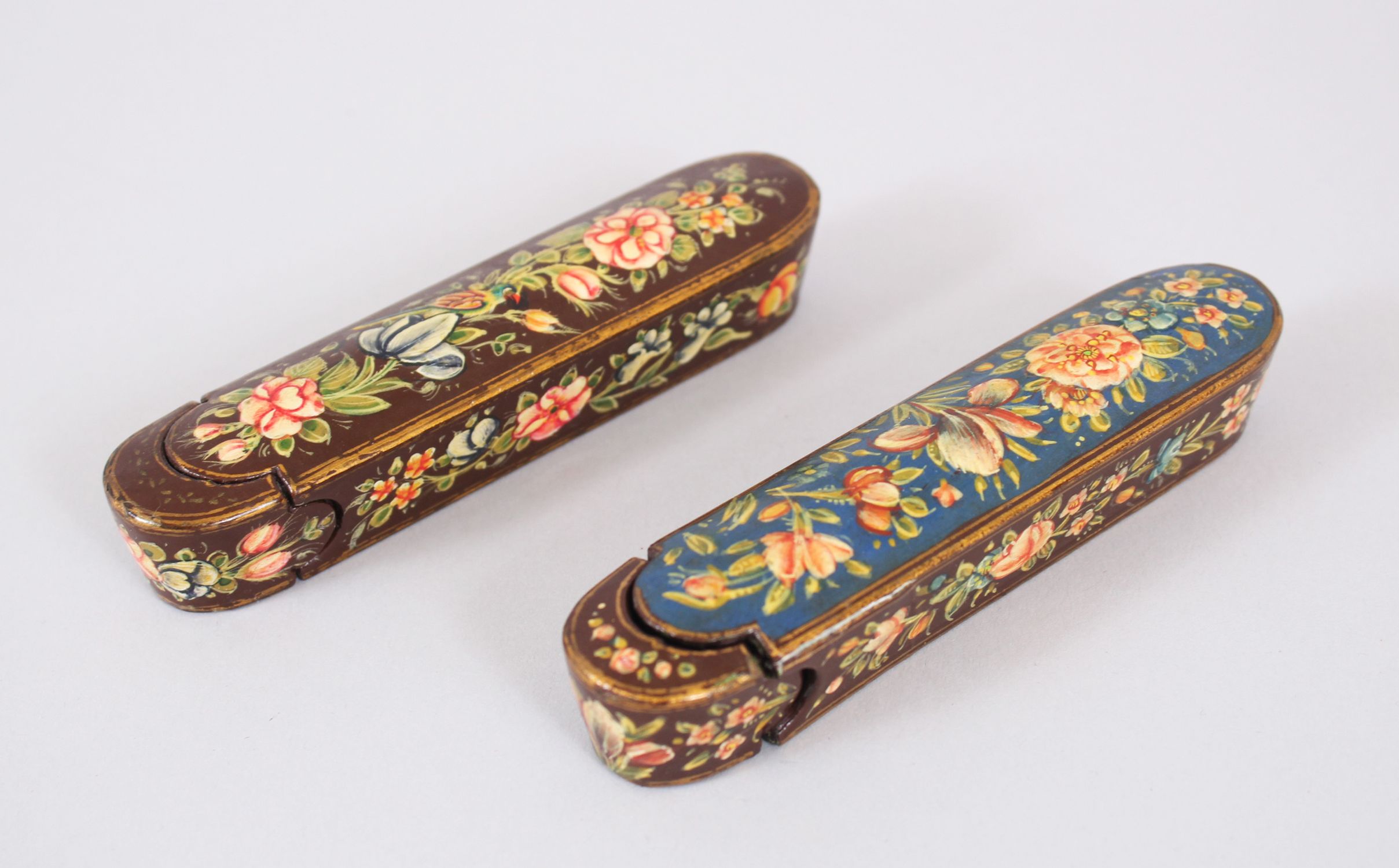 TWO SMALL PERSIAN LACQUER PEN BOXES, 12.5cm long.