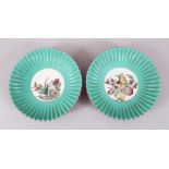 A GOOD PAIR OF CHINESE ENAMELLED FAMILLE ROSE PORCELAIN SCALLOP FORM DISHES, both with central