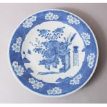 A 19TH CENTURY JAPANESE IMARI / ARITA BLUE & WHITE DISH, decorated with arrays of ikebana and prunus